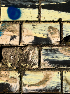 bricks, dirt, different colors, spray paint, wwall