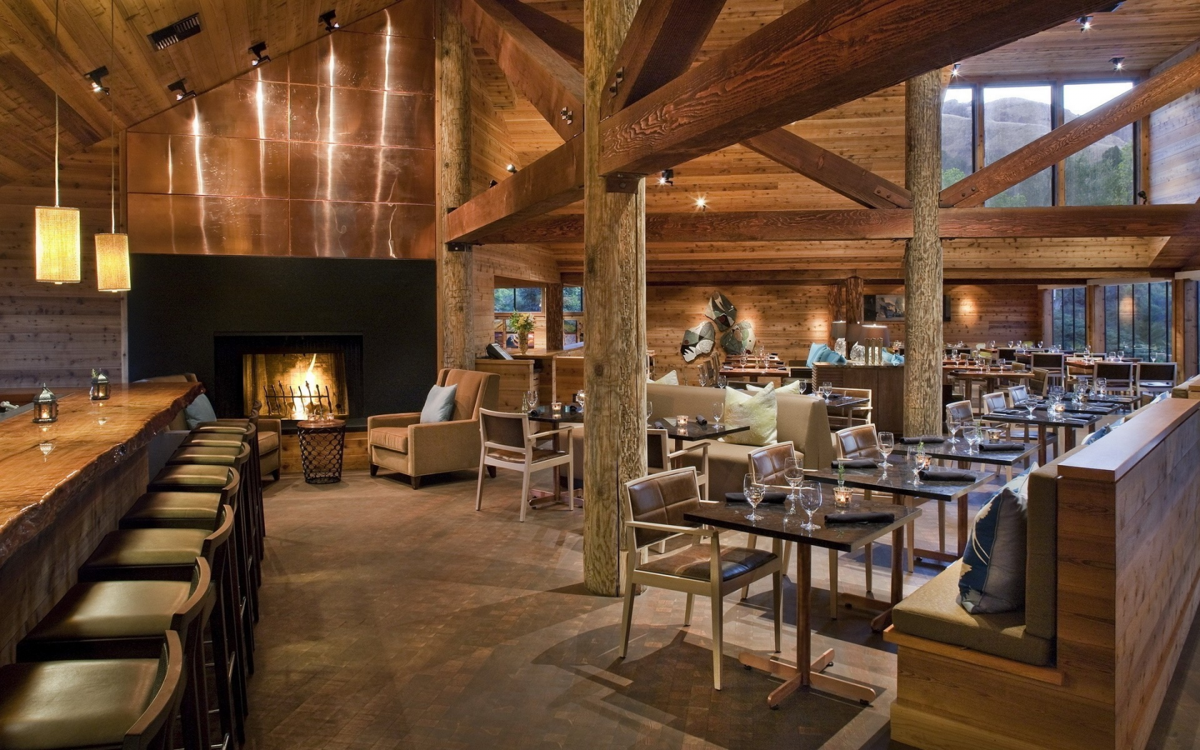 fireplace, chairs, bar, lights, tables, wine glasses, wood