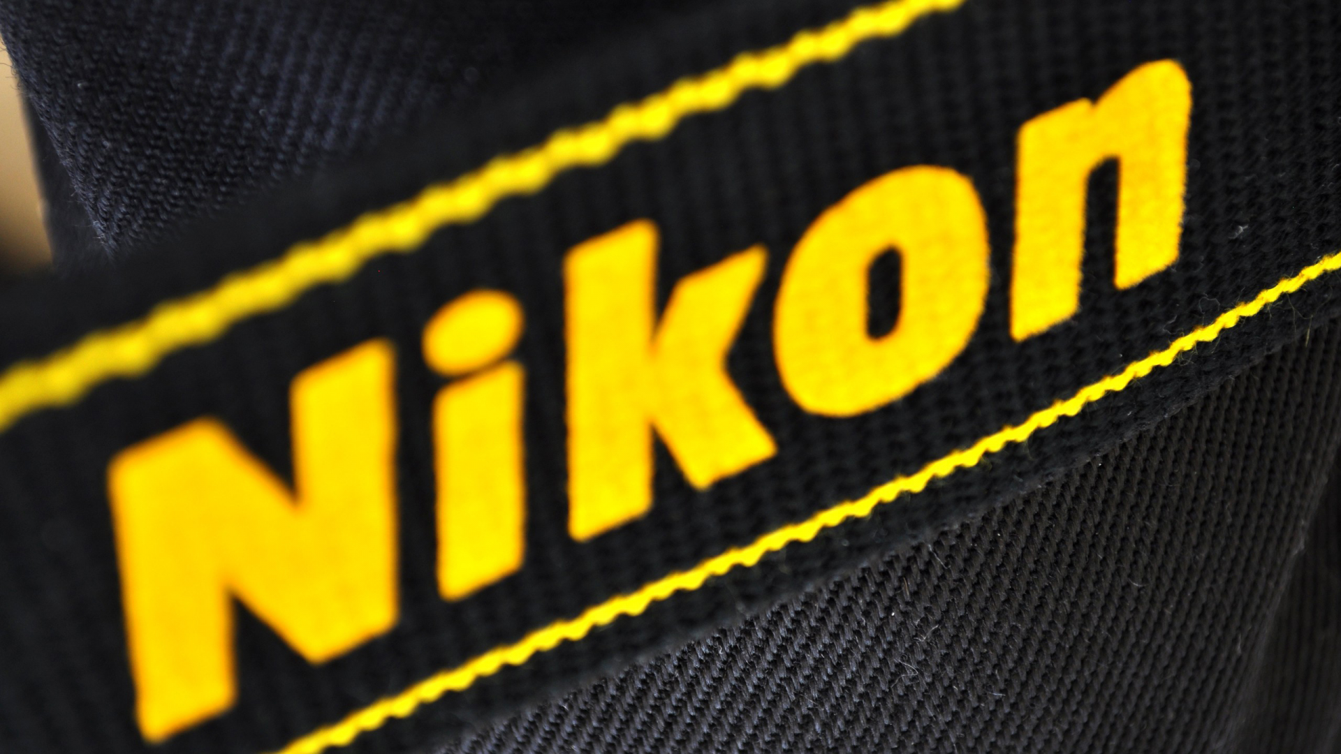 yellow, logo, black, nikon