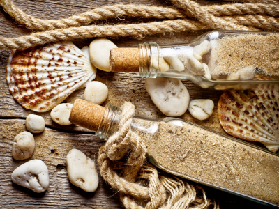 rope, bottle, sand, old wood, shell, stones
