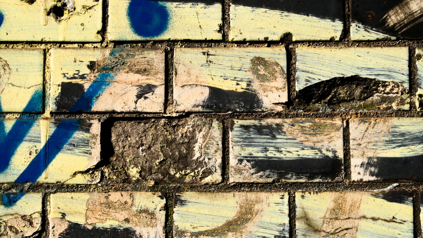 bricks, dirt, different colors, spray paint, wwall