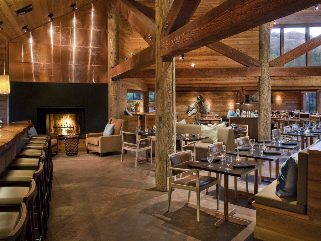 fireplace, chairs, bar, lights, tables, wine glasses, wood