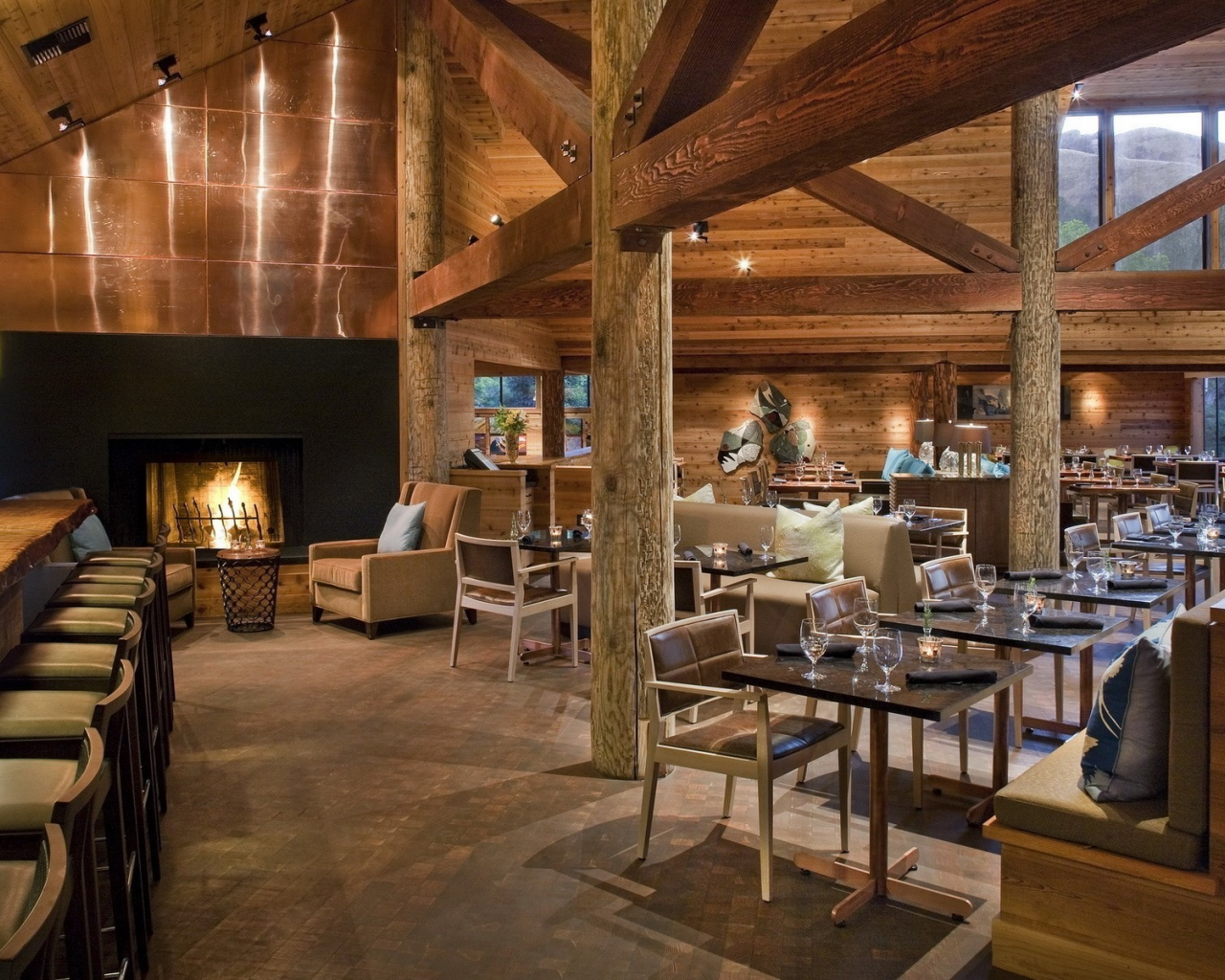 fireplace, chairs, bar, lights, tables, wine glasses, wood