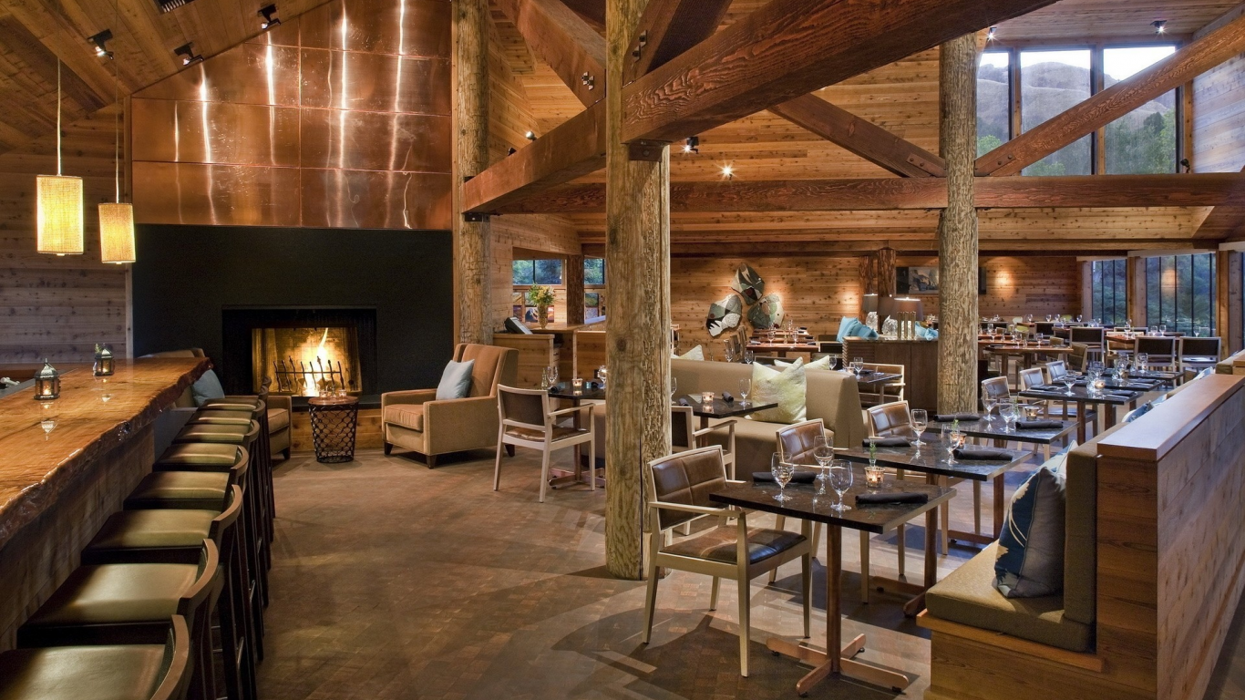 fireplace, chairs, bar, lights, tables, wine glasses, wood